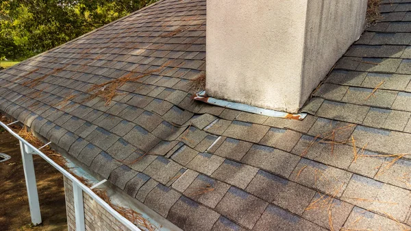 depositphotos 520847672 stock photo roof shingles damaged water leak